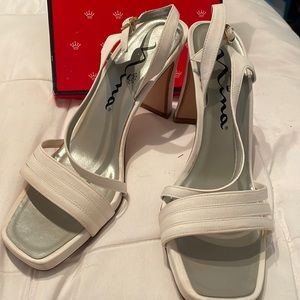 Nine white high heel shoes size 8
